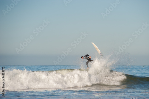 Surfer and board flying in opposite directions.