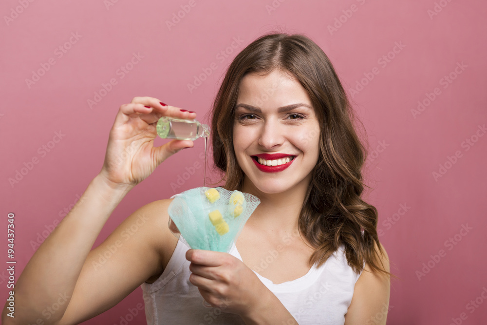 Woman with a bottle of lotion Woman with a bottle of lotion