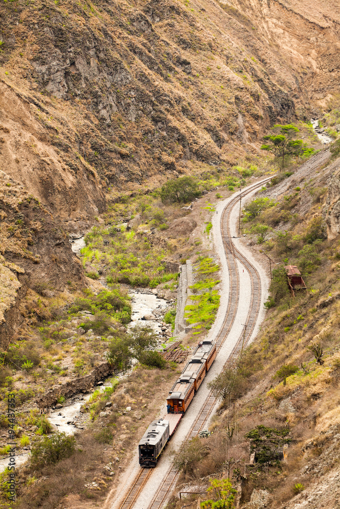 A train passing through the picturesque town of Alausi in Duran, Ecuador, showcasing the country's impressive railway infrastructure.