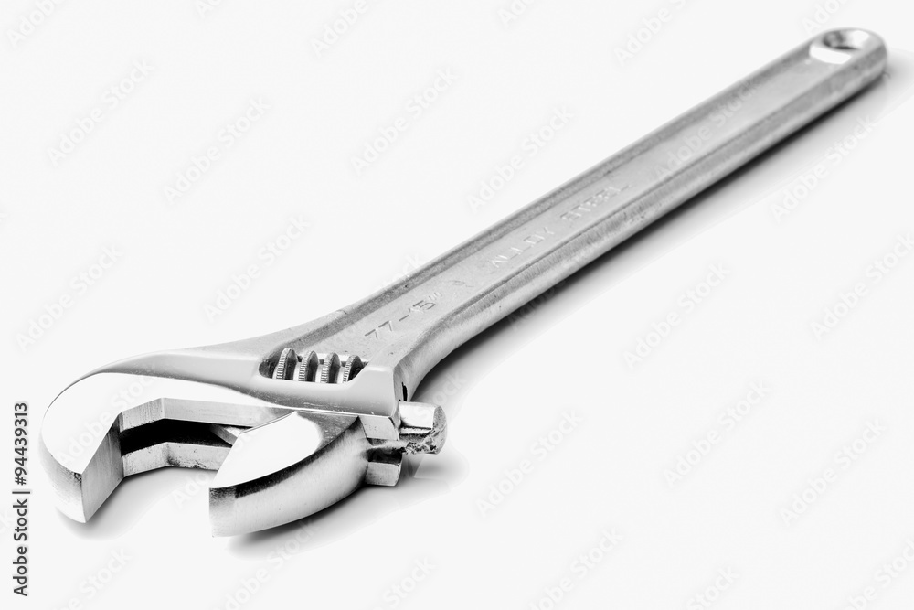 Adjustable chrome wrench with large size for heavy duty tasks,perfect for mechanics and DIY enthusiasts,isolated on a white background. Adjustable chrome wrench with large size for heavy duty tasks,perfect for mechanics and DIY enthusiasts,isolated on a white background.