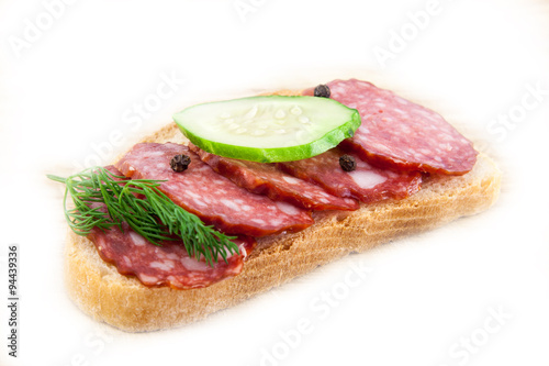 salami sausages on wooden board isolated