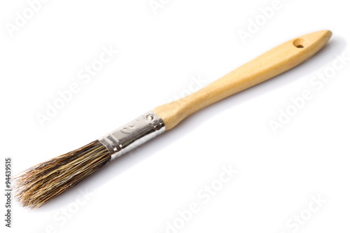 Studio shot of a small brush isolated on white background,showcasing its simplicity and utility for detailed work.