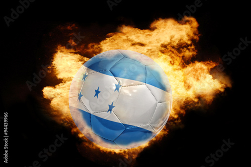 football ball with the flag of honduras on fire