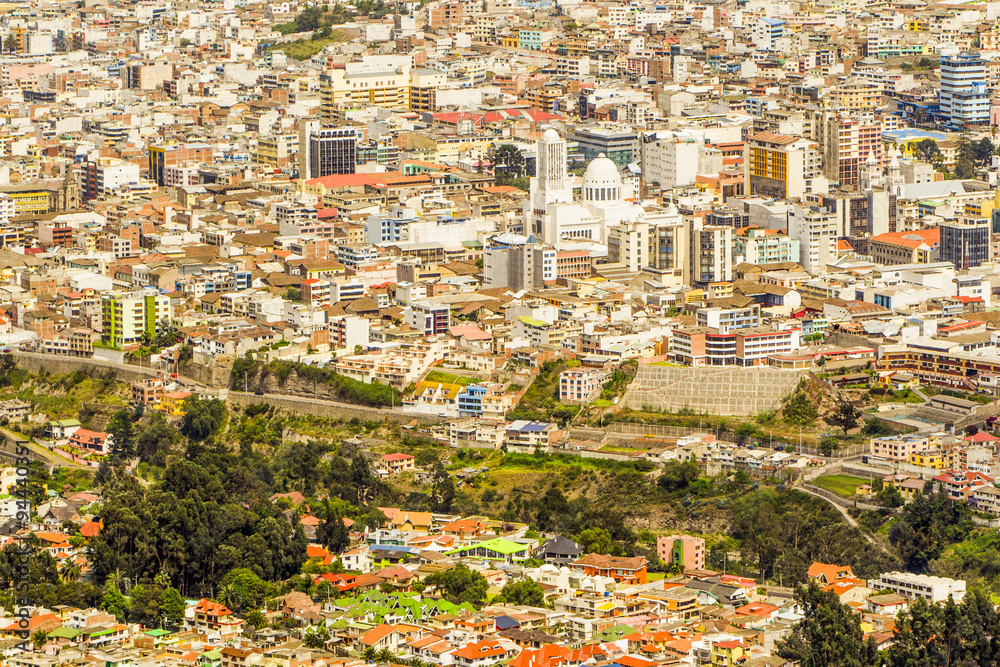 Experience the breathtaking cityscape of Ambato,Ecuador from a high point of view,featuring a stunning modern cathedral at the heart of the town.