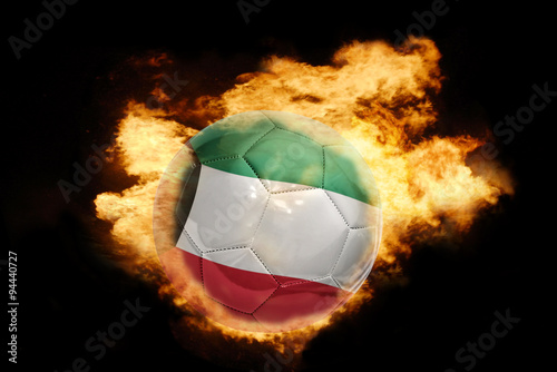 football ball with the flag of kuwait on fire