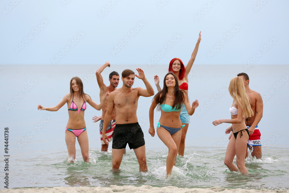 Beautiful young people having fun on beach