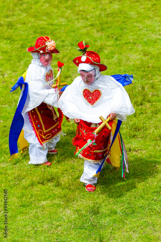 Adorable children donning traditional dwarf costumes in Lloa,Ecuador,perfect for cultural events and festivals. photo