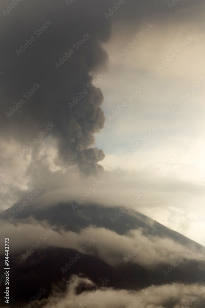 Tungurahua volcano eruption in May 2011 released a large quantity of ash,darkening the sky with a dramatic vertical composition. Tungurahua volcano eruption in May 2011 released a large quantity of ash,darkening the sky with a dramatic vertical composition.