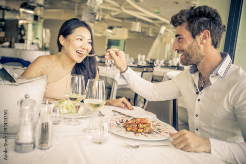 Young couple eating in a restaurant.