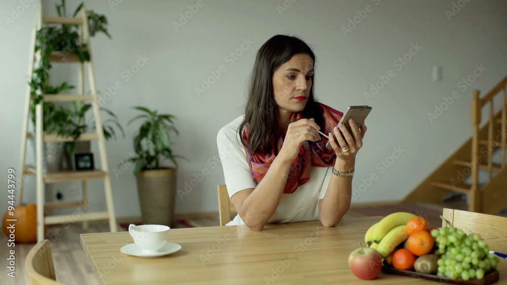 Woman browsing internet on smartphone and looking dissatisfied
Woman browsing internet on smartphone and looking dissatisfied