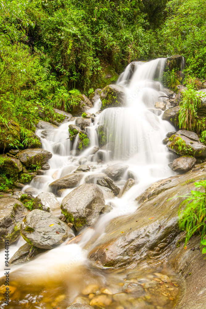 Experience the breathtaking beauty of the Machay Mountain waterfall near Banos,Ecuador,as you immerse yourself in the natural wonders of this stunning destination.