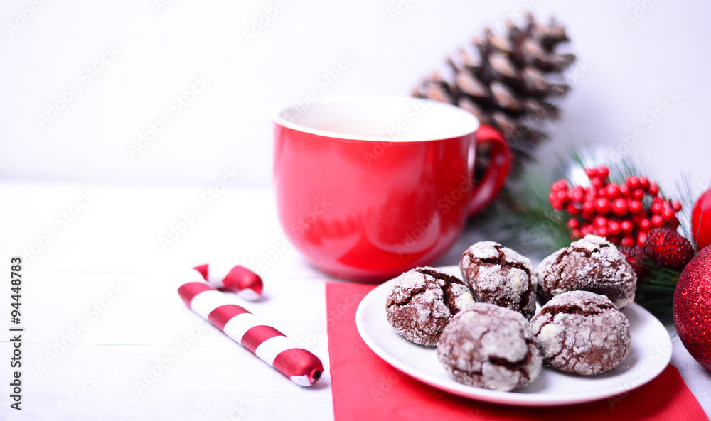 Christmas ornaments with cookies and hot chocolate on white back