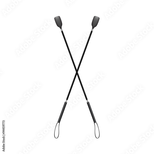 Two crossed riding whips