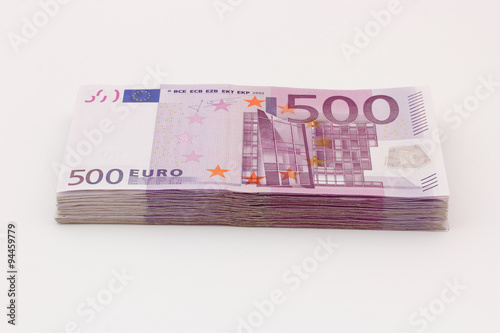 Money - Isolated stack of Five hundred (500) euro bills banknotes with white background