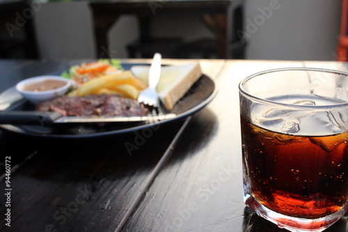 Beef steak with cola drink