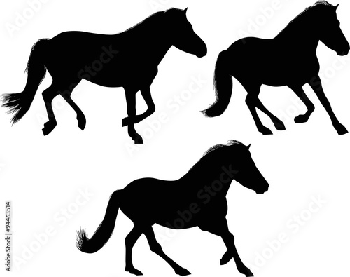 three running black horses on white