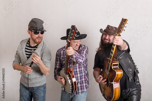 trio of cheerful musicians