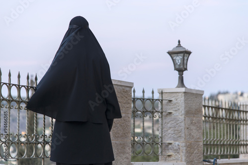 Nun watching the view of jerusalem