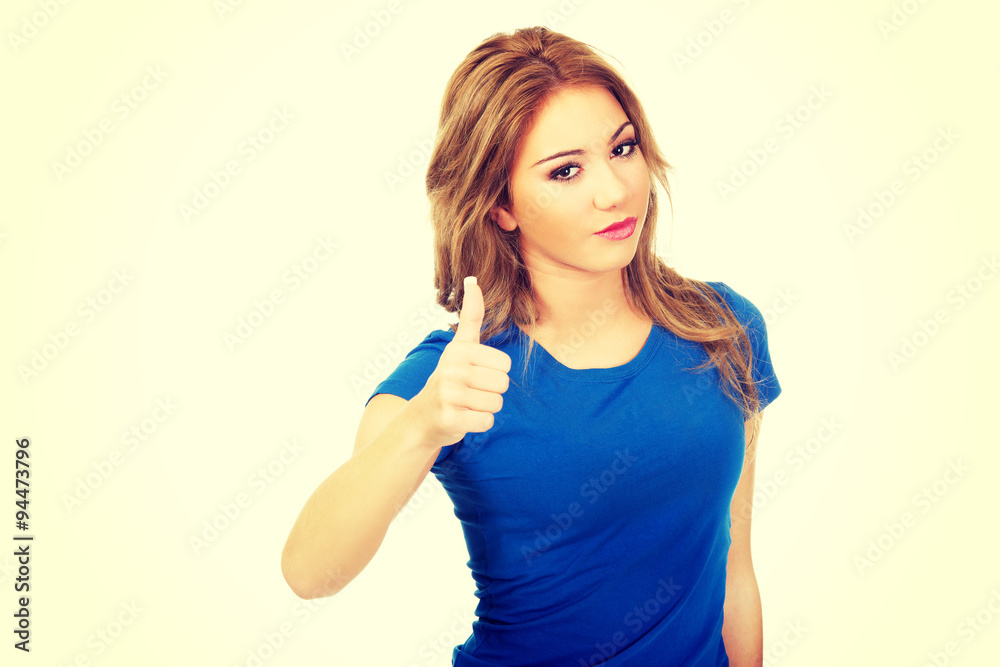 Young happy woman with thumbs up. Young happy woman with thumbs up.