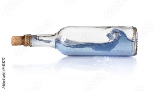 Storm inside glass bottle with water and cork on white background