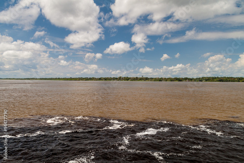 The Meeting of Waters (Encontro das Aguas) is the confluence between the Rio Negro river, with dark water, and lighter Amazon river or Rio Solimoes