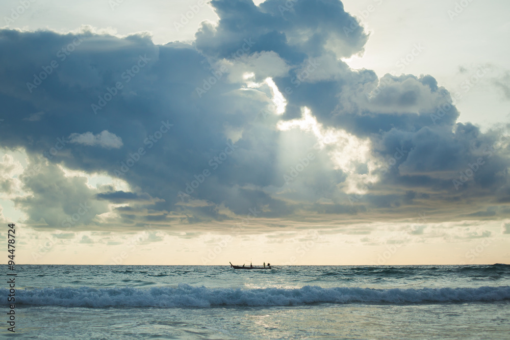 A lot of cloud over long tail boat on the andaman sea, Phuket, Thailand