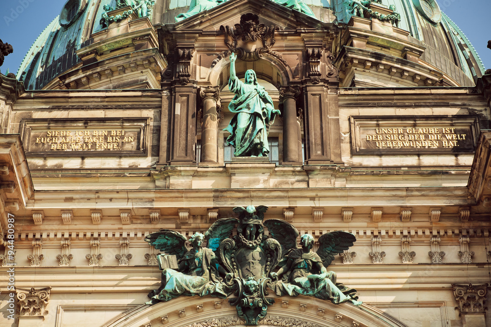 Great stone Jesus on the top of facade of the Berliner Dom