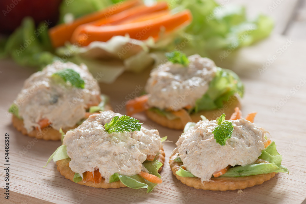Delicious crackers with tuna salad topping. Delicious crackers with tuna salad topping.