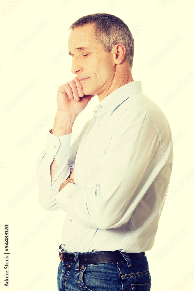 Side view pensive man touching chin Side view pensive man touching chin