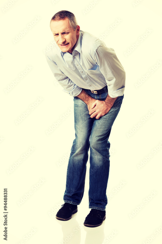 Man covering his painful crotch Man covering his painful crotch
