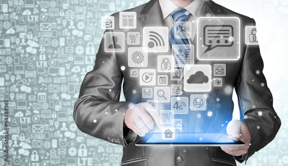 Business man using tablet PC with social media icon set Business man using tablet PC with social media icon set