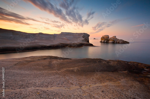 Coastal scenery with pale volcanic rocks near Sarakiniko beach in Milos island, Greece.