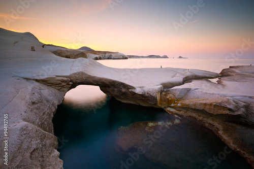 Coastal scenery with pale volcanic rocks near Sarakiniko beach in Milos island, Greece.