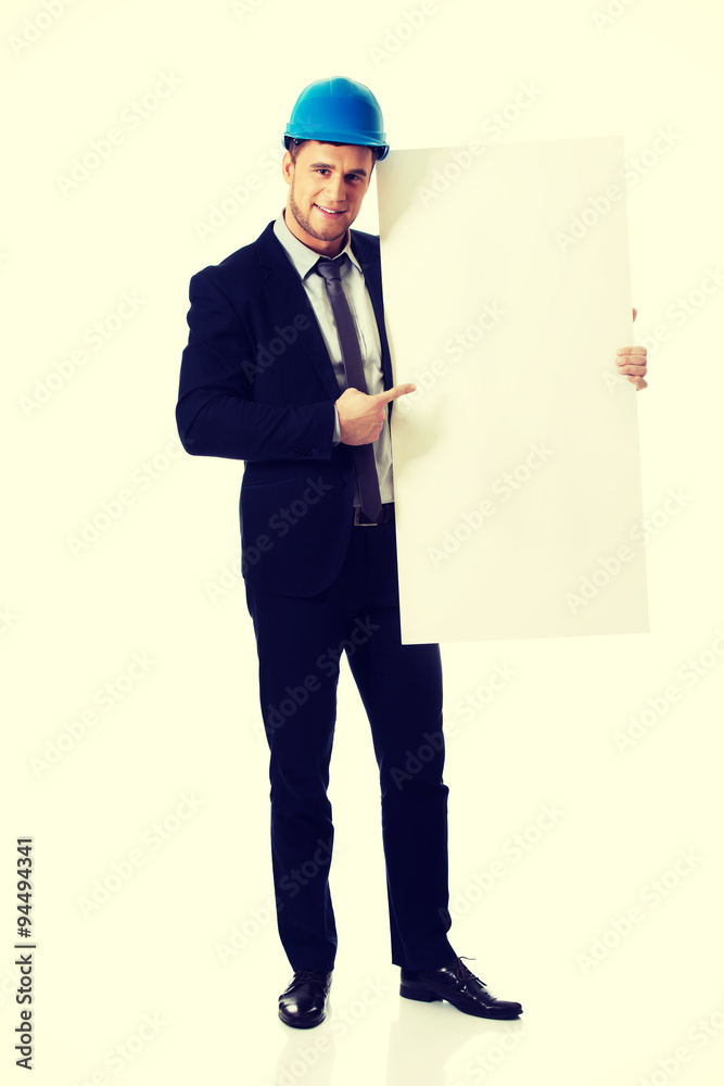 Businessman enginner showing empty banner. Businessman enginner showing empty banner.