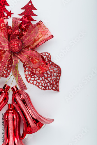 Red christmas bell decoration hanging on white 
