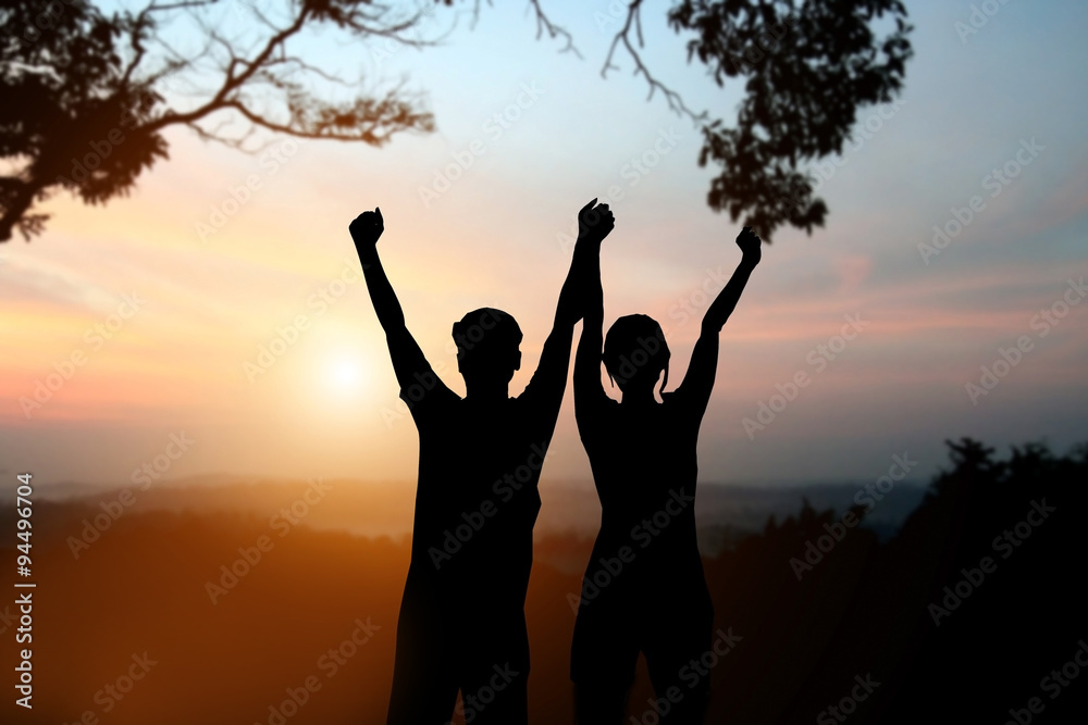 silhouette of man and women show arm up for achievements success