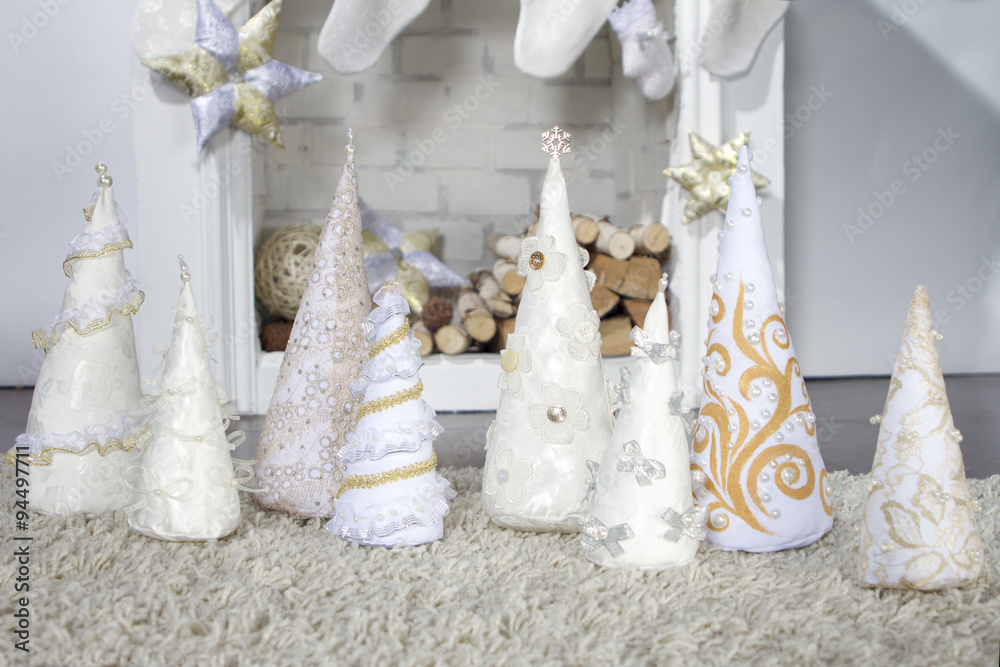 Decorative Christmas tree made of cloth and fireplace. Photographed in the studio