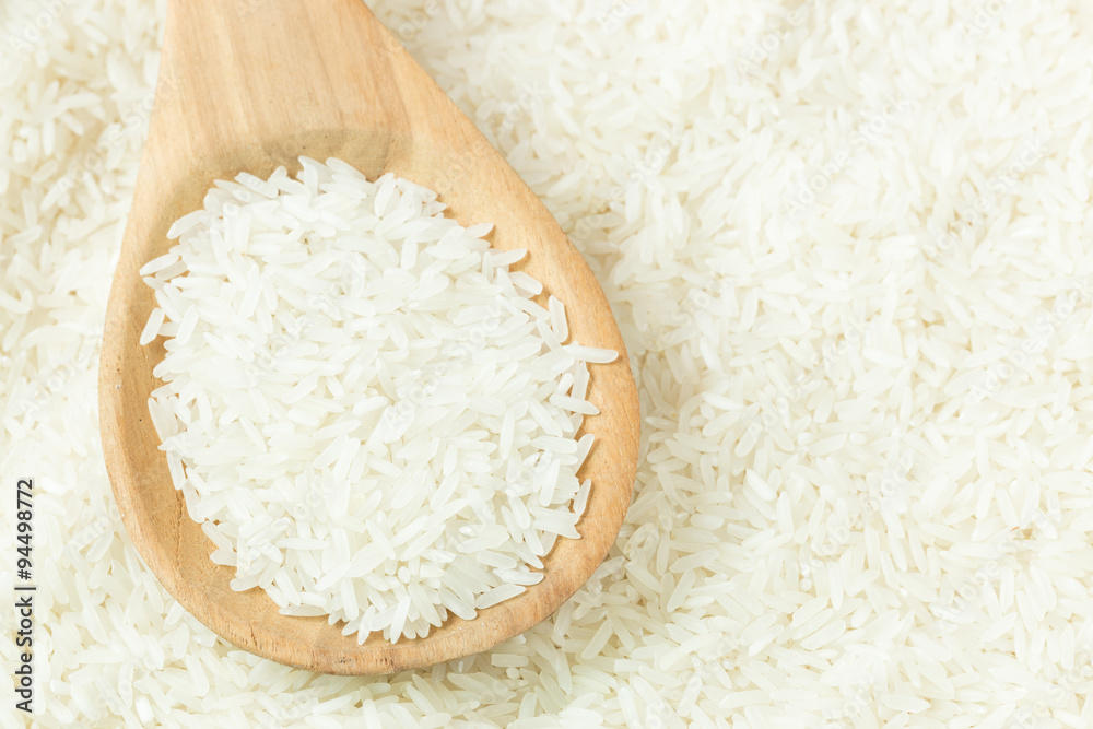 rice on wooden spoon rice on wooden spoon