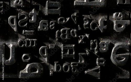 Metal Lettrpress Types.
A background from many historic typographical letters in black and white with white background. photo