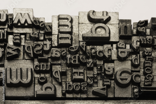 Metal Lettrpress Types.
A background from many historic typographical letters in black and white with white background.
