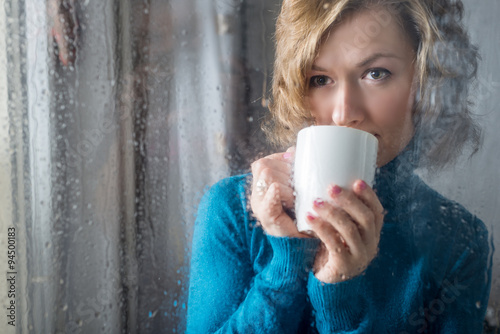 Portrait of Young woman with cup