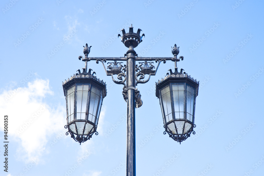 Typical classic portuguese streetlight against a blue sky