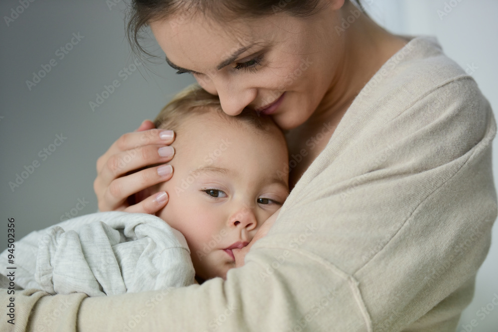 Mom breast feeding baby girl