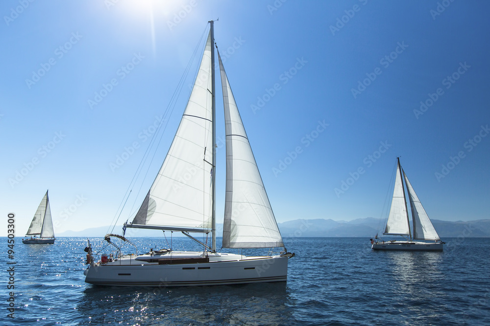 Sailing regatta. Sailing in the wind through the waves. Luxury yachts.