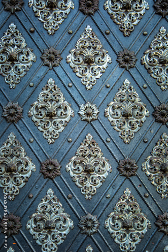 Vintage ancient background. Rustic ancient doors pattern medieval repetitive ornaments.
