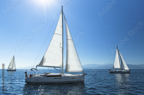 Sailing regatta. Sailing in the wind through the waves. Luxury yachts. © De Visu