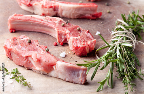 Raw meat, mutton, lamb rack on a wooden background