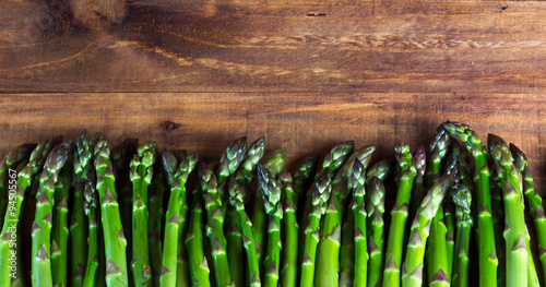background. fresh asparagus on wooden table