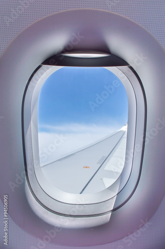 viewing flying over clouds by the aircraft window