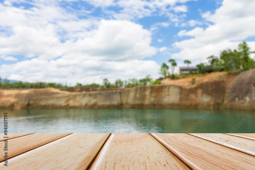 Empty Wooden deck table over blur nature background